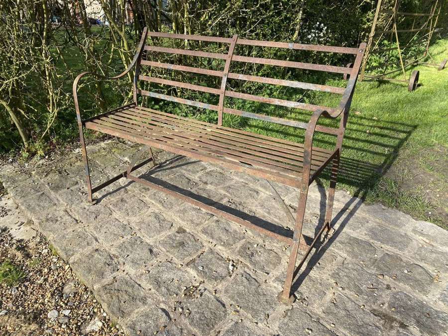 Small English Regency wrought iron strapwork garden bench.